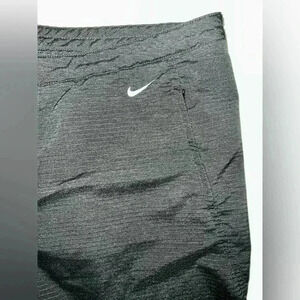 Nike pants, button,zip, ankle slit, mesh back knee
